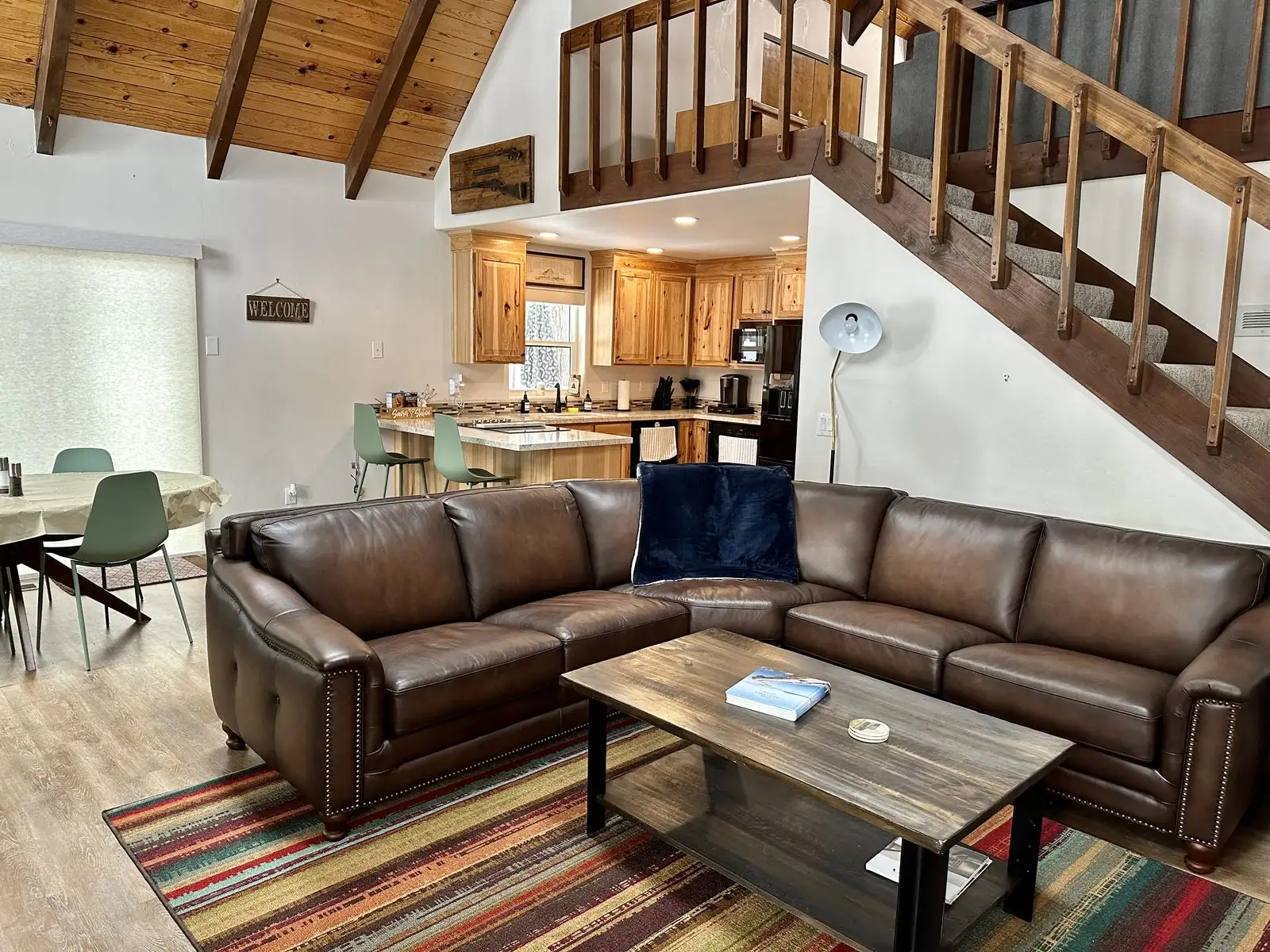 Bright daytime living area with leather sectional