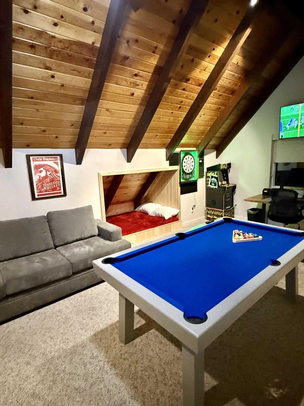 Built-in bonus bed nook beside the sofa