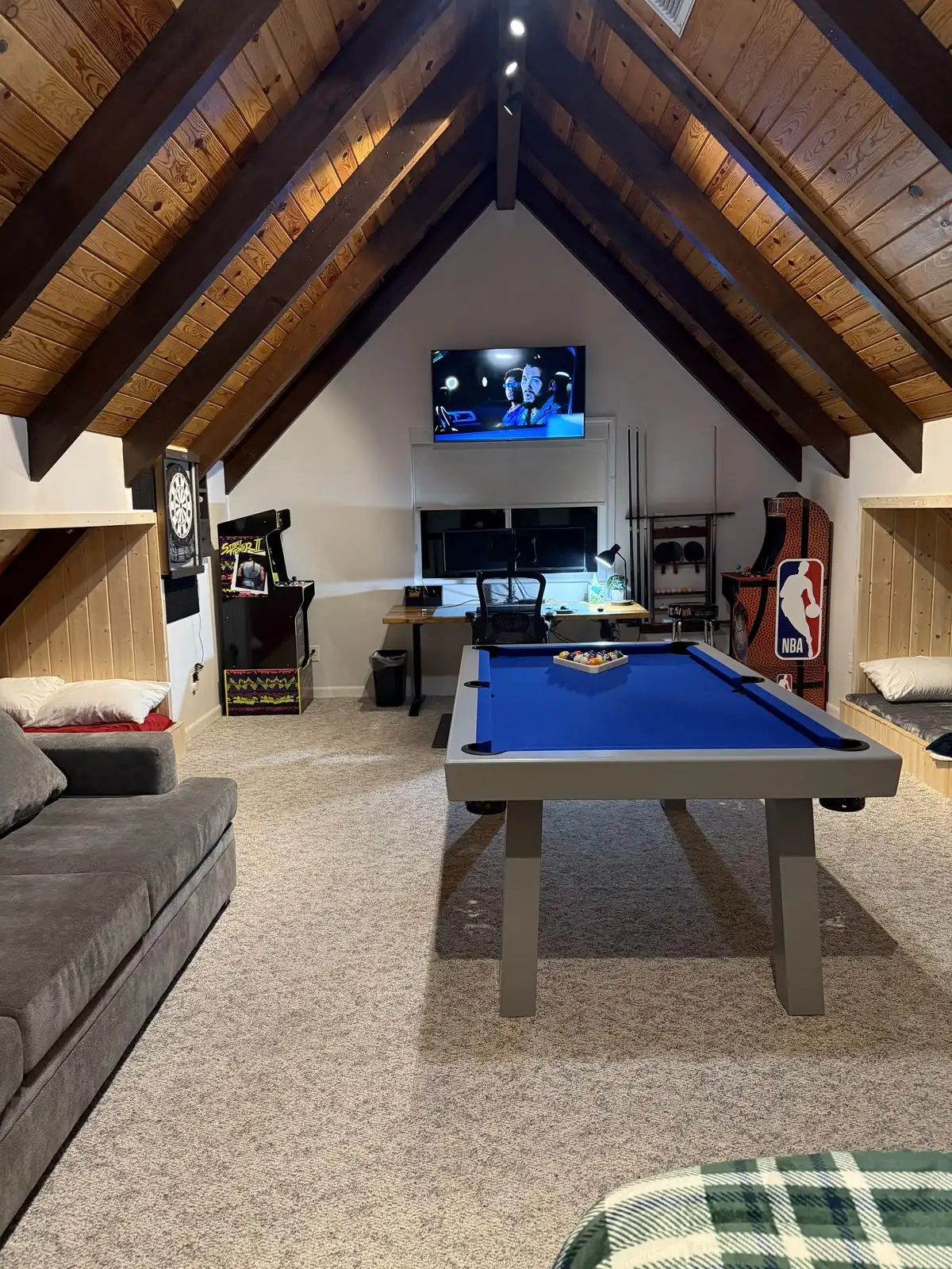 Pool table with TV and work desk in the loft game room