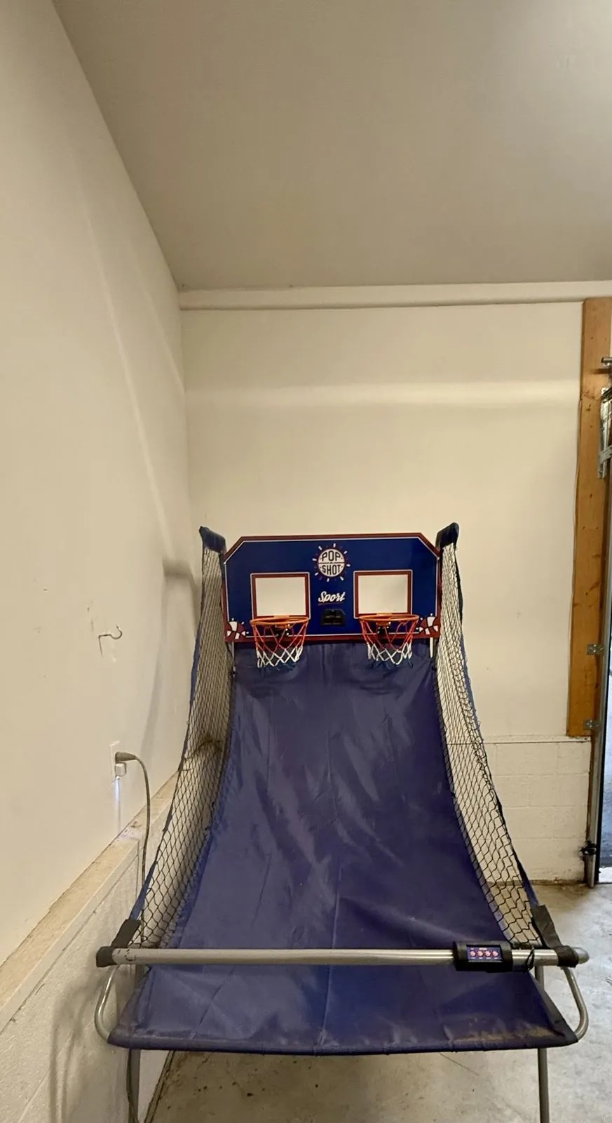 Pop-A-Shot basketball arcade game in the garage