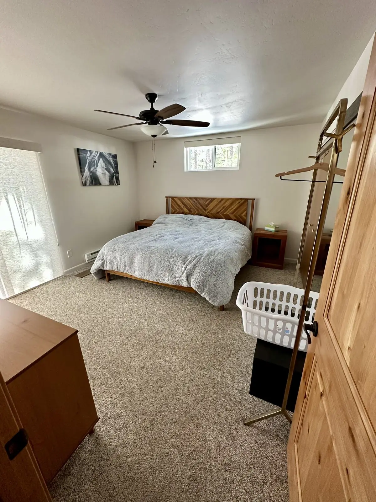 Primary bedroom with reading corner and dressing mirror